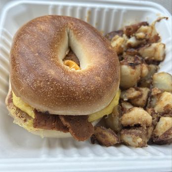 The Vegan Nest Café - Vegan egg, cheese, and bacon on a bagel. Hashbrowns were a bonus. - Vegan Near Me - Clinton, Massachusetts The Vegan Nest Café - Vegan egg, cheese, and bacon on a bagel. Hashbrowns were a bonus. - Vegan Near Me - Clinton, Massachusetts