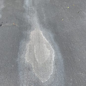 Wolf's Sealcoating - a wet driveway - General Contractors Near Me - Joliet, Illinois