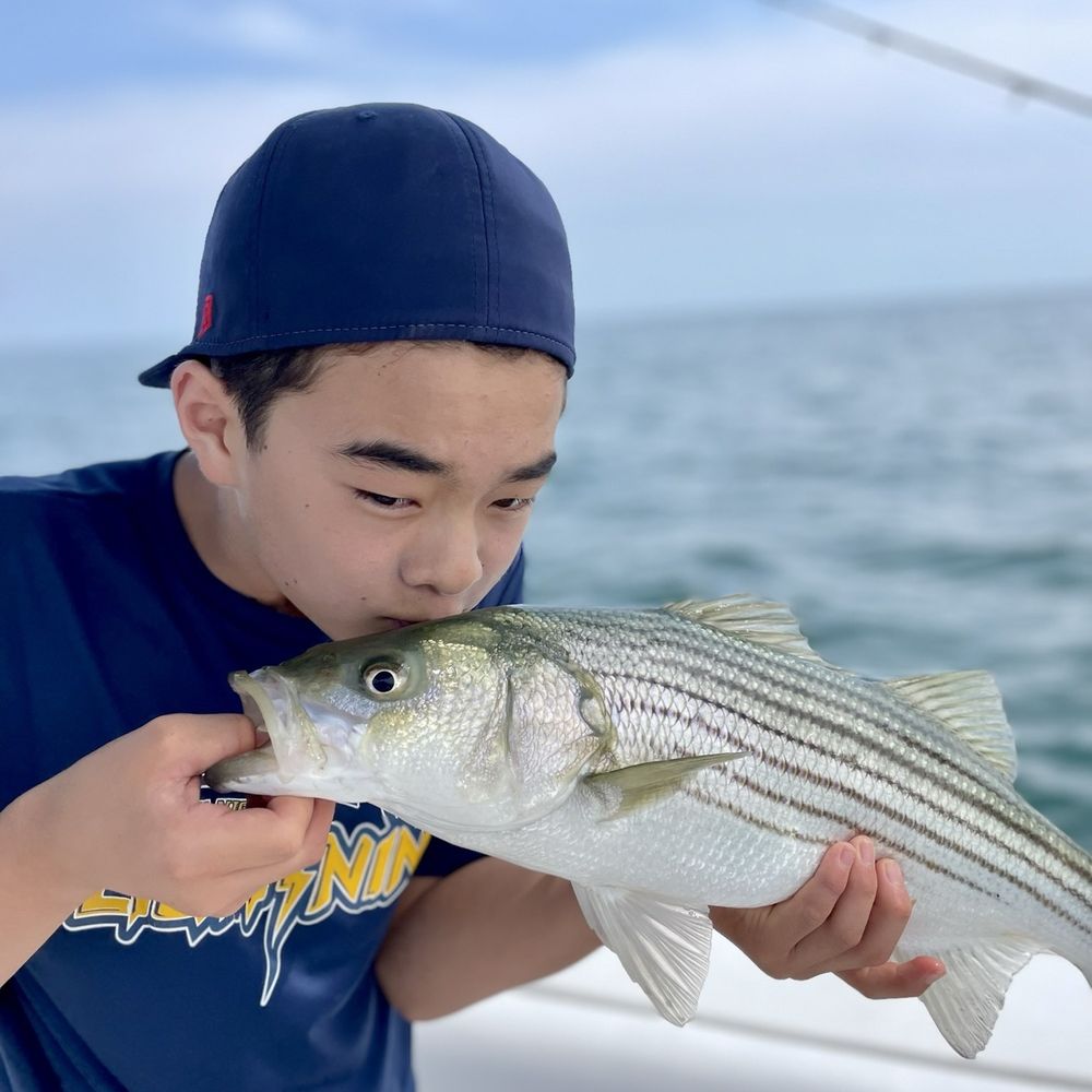 Blue Bandit Charters - Got to kiss the first catch. - Boat Charters Near Me