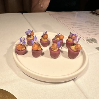 Linden - Not sure what these were called but it was the first thing they served us. It's a potato with hummus and a roasted chicken pea. - New American Near Me - Los Angeles, California