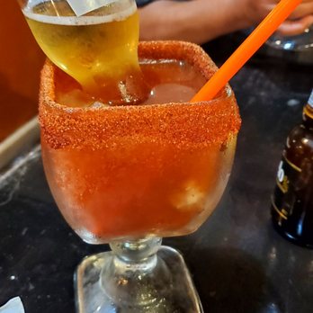 Jalisco's Grill - a person pouring a drink into a glass - Mexican Near Me - El Centro, California Jalisco's Grill - a person pouring a drink into a glass - Mexican Near Me - El Centro, California