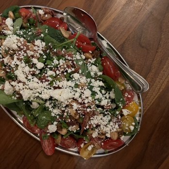 The Goat & Vine - popeye & olive oil: spinach, bacon, spicy marcona almonds, feta cheese, grape tomatoes, green onions + champagne vinaigrette = $16 - Pizza Near Me - Temecula, California The Goat & Vine - popeye & olive oil: spinach, bacon, spicy marcona almonds, feta cheese, grape tomatoes, green onions + champagne vinaigrette = $16 - Pizza Near Me - Temecula, California