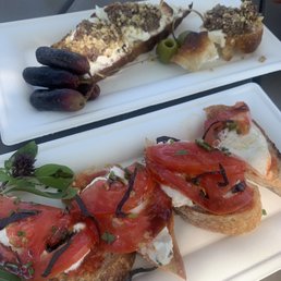 Olive tapenade and tomato and mozzarella crostini