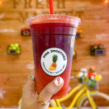 Pina smoothies - a hand holding a cup of fruit smoothie - Juice Bars & Smoothies Near Me - Poway, California