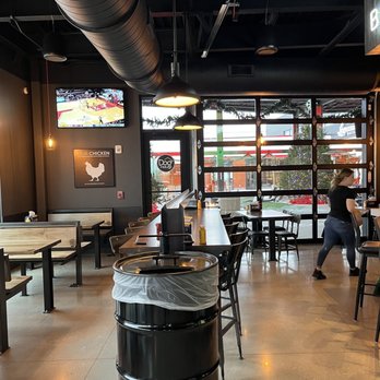 Dog Haus - a restaurant with tables and chairs - Burgers Near Me - Franklin, Wisconsin