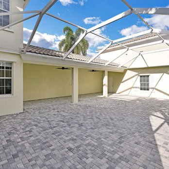 Triple M Brick Pavers - a patio area with a glass roof - General Contractors Near Me - Jupiter, Florida Triple M Brick Pavers - a patio area with a glass roof - General Contractors Near Me - Jupiter, Florida