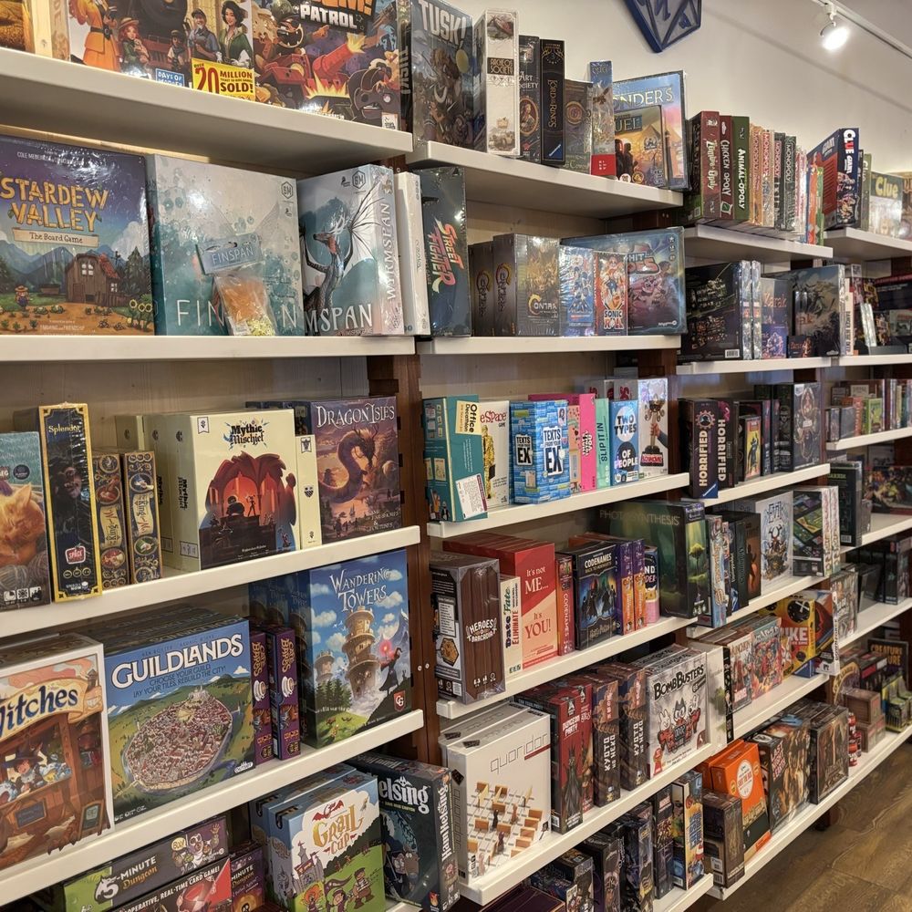 Treasures - The front south wall of games and puzzles - Tabletop Games Near Me - Naperville, Illinois Treasures - The front south wall of games and puzzles - Tabletop Games Near Me - Naperville, Illinois