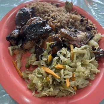 Caribbean & Soule Restaurant - Jerk Chicken (Select 2 sides) with rice and beans and cabbage - Caribbean Near Me - St. Augustine, Florida Caribbean & Soule Restaurant - Jerk Chicken (Select 2 sides) with rice and beans and cabbage - Caribbean Near Me - St. Augustine, Florida