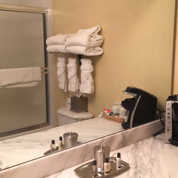 The Terrace Hotel Lakeland, Tapestry Collection by Hilton - Bathroom w/creepy mirror. Kinda weird that the Keurig was in there lol - Hotels Near Me - Lakeland, Florida The Terrace Hotel Lakeland, Tapestry Collection by Hilton - Bathroom w/creepy mirror. Kinda weird that the Keurig was in there lol - Hotels Near Me - Lakeland, Florida