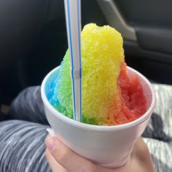 Rainbow snow cone - with a delicious big bite missing!