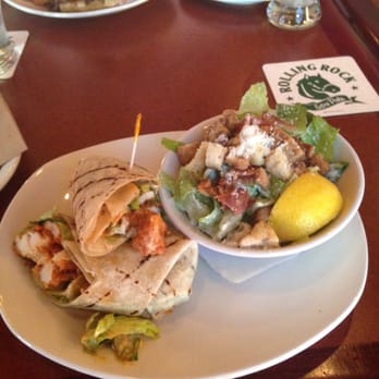 St. Louis Bar & Grill - Buffalo chicken Caesar wrap and a side Caesar salad - Chicken Wings Near Me - Moncton, New Brunswick St. Louis Bar & Grill - Buffalo chicken Caesar wrap and a side Caesar salad - Chicken Wings Near Me - Moncton, New Brunswick