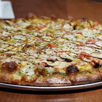 D2 Sports Pub - a pizza on a table - Sports Bars Near Me - Hobart, Wisconsin D2 Sports Pub - a pizza on a table - Sports Bars Near Me - Hobart, Wisconsin