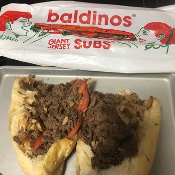 Baldinos - a half eaten sandwich on a tray - Breakfast & Brunch Near Me - Pooler, Georgia