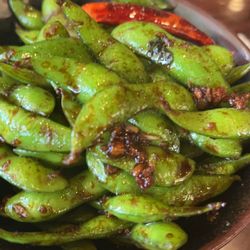 Umi Sushi & Ramen - Spicy garlic edamame (it's not on the menu this way, but order it) so good