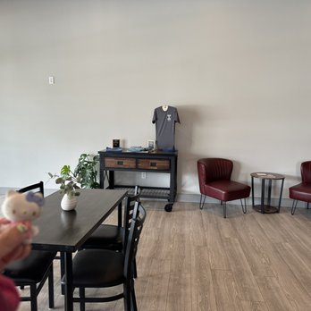 Local Grounds Coffee - a person holding a cup of coffee - Coffee & Tea Near Me - Manson, Washington Local Grounds Coffee - a person holding a cup of coffee - Coffee & Tea Near Me - Manson, Washington