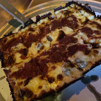 Norm's Wayside - a slice of pizza on a plate - Pizza Near Me - Buffalo, Minnesota