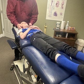 Green Chiropractic Clinic - Dr. Green, examining my eight-year-old sons C-Spine and preparing to make an adjustment! - Chiropractors Near Me - Oxford, Alabama Green Chiropractic Clinic - Dr. Green, examining my eight-year-old sons C-Spine and preparing to make an adjustment! - Chiropractors Near Me - Oxford, Alabama