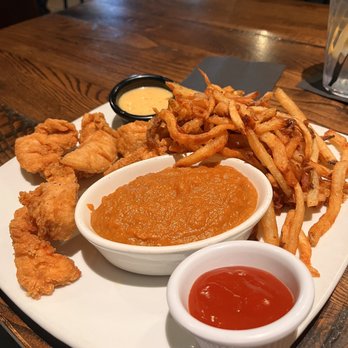 Local Goat - Chicken tenders with sweet potatoes and fries - New American Near Me - Pigeon Forge, Tennessee Local Goat - Chicken tenders with sweet potatoes and fries - New American Near Me - Pigeon Forge, Tennessee