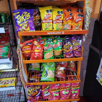 ZHUMI Bakery & Restaurant - a shelf of chips and snacks - Mexican Near Me - Whitestone, New York ZHUMI Bakery & Restaurant - a shelf of chips and snacks - Mexican Near Me - Whitestone, New York