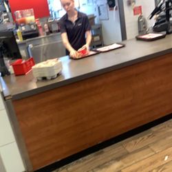 Wendy's - This girl is so rude she slammed down a bag of fries in a customers face and cursed at her just because she told her that the fries are cold