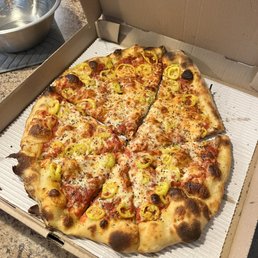 Hand tossed pie with banana pepps. Hand tossed pie with banana pepps.
