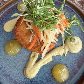 Papaya Club - Crab Cake: jumbo lump crab meat, yuzu kosho ailoi, papaya slaw, herbs, mango ginger gastrique. $28 - Cocktail Bars Near Me - Orlando, Florida Papaya Club - Crab Cake: jumbo lump crab meat, yuzu kosho ailoi, papaya slaw, herbs, mango ginger gastrique. $28 - Cocktail Bars Near Me - Orlando, Florida