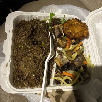 Gisele's Creole Cuisine - Black rice with fried goat and plaintain - Bars Near Me - Silver Spring, Maryland Gisele's Creole Cuisine - Black rice with fried goat and plaintain - Bars Near Me - Silver Spring, Maryland