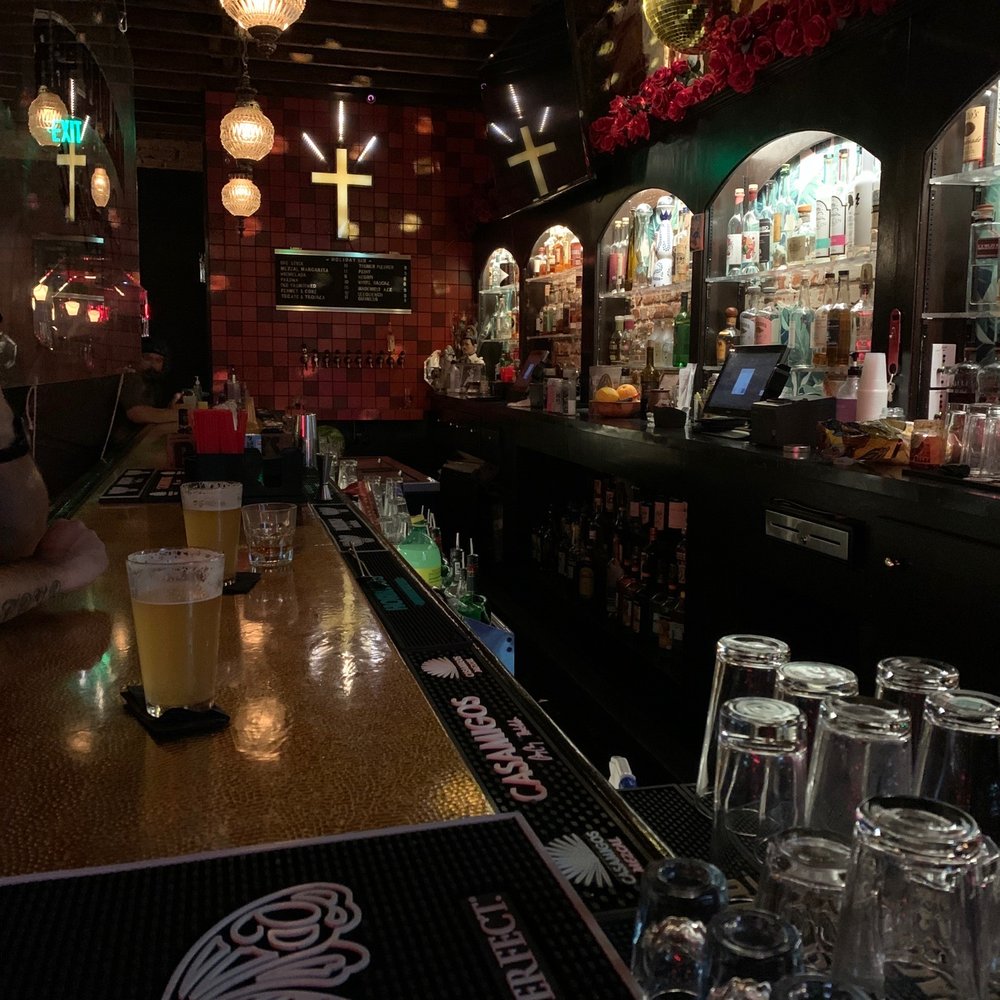 HOLIDAY BAR - a man sitting at the bar - Bars Near Me - Los Angeles, California