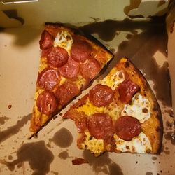 Amazing Pizza - This is one slice. Although it's good size, it was extremely thin and burned.