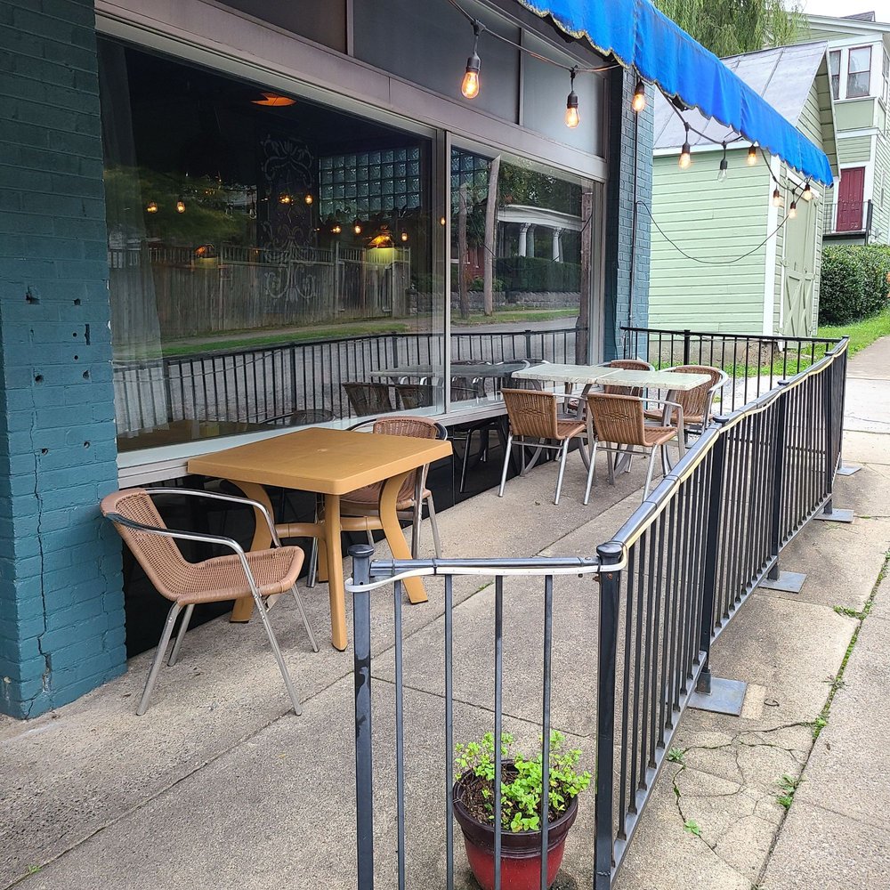 Evie's Bistro and Bakery - The outside seating area with the blue owning. - New American Near Me - Roanoke, Virginia Evie's Bistro and Bakery - The outside seating area with the blue owning. - New American Near Me - Roanoke, Virginia