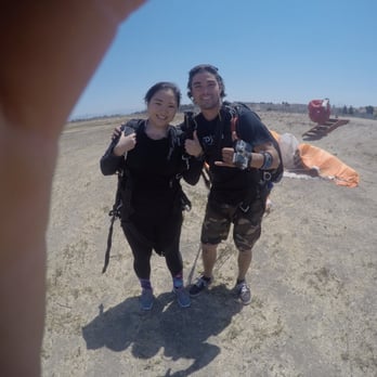 GoJump Oceanside - My instructor Connor and I after my first skydive! - Skydiving Near Me - Oceanside, California