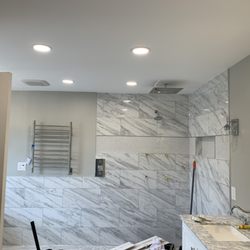 The Flash Electric - Bathroom remodel. Check out the slim led lights.