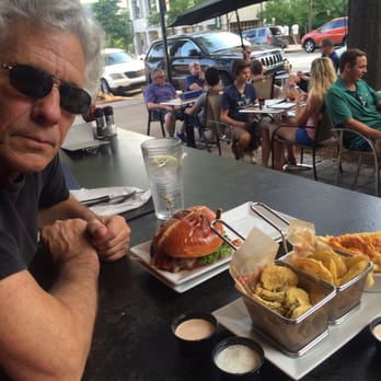 Grill Marks - My husband/artist Fish enjoying the food and the view of Main Street. - Burgers Near Me - Greenville, South Carolina