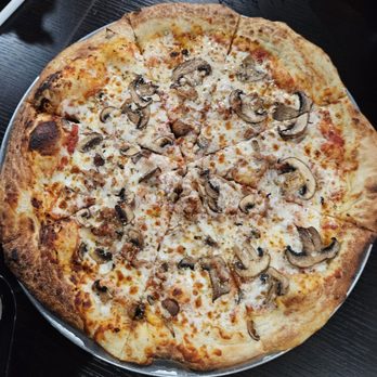 Punk Rock Pizza - Mushroom and sausage pizza - Pizza Near Me - Daytona Beach, Florida Punk Rock Pizza - Mushroom and sausage pizza - Pizza Near Me - Daytona Beach, Florida
