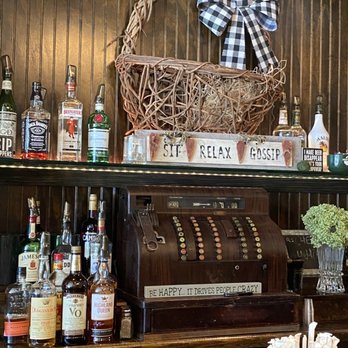The Victorian Room - a display of liquor bottles and a cash register - Caterers Near Me - Bay Shore, New York The Victorian Room - a display of liquor bottles and a cash register - Caterers Near Me - Bay Shore, New York