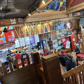 BuffaLouie's - people sitting at tables in a restaurant - Chicken Wings Near Me - Bloomington, Indiana