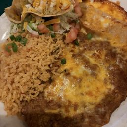 Cheese enchilada, taco, beans and rice