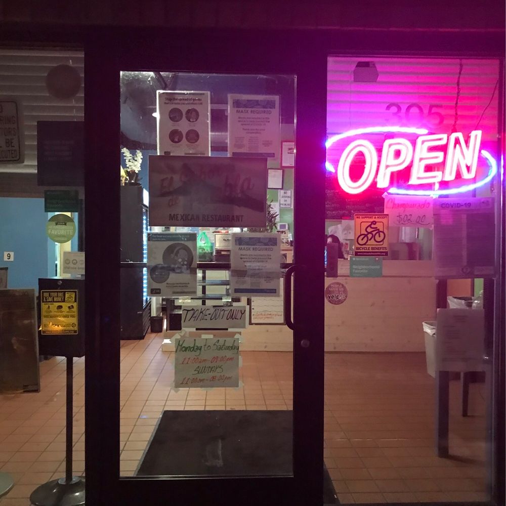 the open sign in the window the open sign in the window