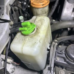 Alpine Auto And Off Roading - The coolant cover and lines were moved and not put back properly.
