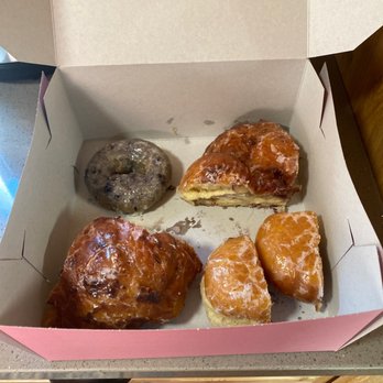 Dank Donuts - Blueberry donut, raspberry jelly donut and 1/2 a boysenberry fritter.  We already ate the other 1/2. Should have taken a before shot. - Coffee & Tea Near Me - Big Bear Lake, California