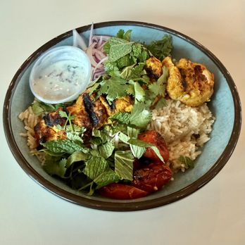 Botiwalla by Chai Pani - Boti Rice Bowl - Basmati rice w yogurt, fried onions, & biryani spices. Topped w Chicken Tikka kabab, onions, tomatoes, mint, cilantro. - Indian Near Me - Raleigh, North Carolina Botiwalla by Chai Pani - Boti Rice Bowl - Basmati rice w yogurt, fried onions, & biryani spices. Topped w Chicken Tikka kabab, onions, tomatoes, mint, cilantro. - Indian Near Me - Raleigh, North Carolina