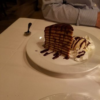 Aspen Grille - 10 layer yellow cake with a chocolate icing - New American Near Me - Myrtle Beach, South Carolina Aspen Grille - 10 layer yellow cake with a chocolate icing - New American Near Me - Myrtle Beach, South Carolina