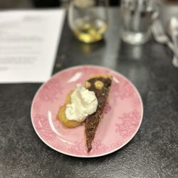Central Coast Culinary & Catering - Mmm dessert. Bananas foster with fresh whipped cream over a Nutella cake