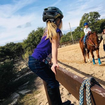 XLR8 Ranch - Preparing a family for a trail ride - Horse Boarding Near Me - Dripping Springs, Texas XLR8 Ranch - Preparing a family for a trail ride - Horse Boarding Near Me - Dripping Springs, Texas