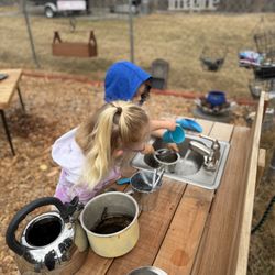 Buzybeez Preschool - Mud kitchen fun