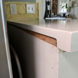 Plywood visible under the counter. According to the installers this is how it's supposed to look?