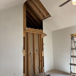 Promise Landscaping and Home Repairs - Fireplace removal ( room too small for furniture placement)