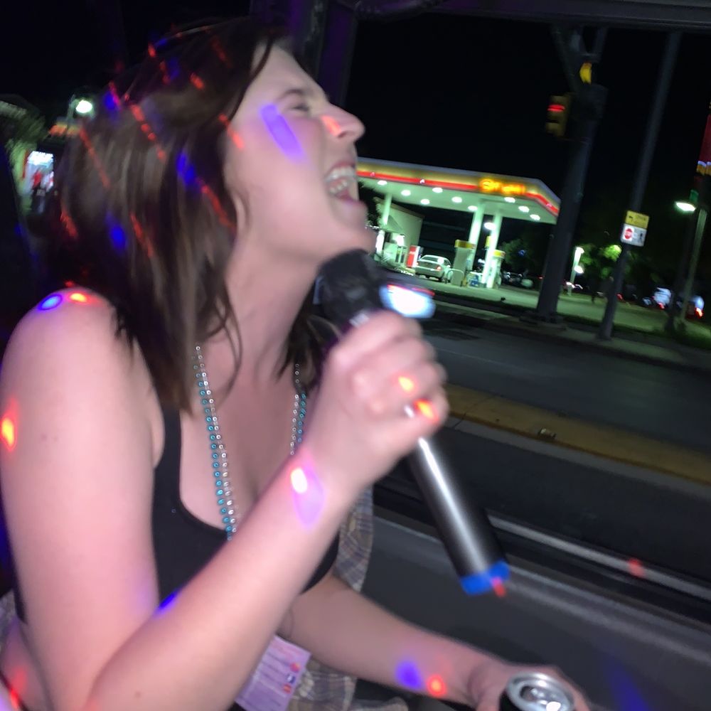 Your Karaoke Fun Cab - a woman singing into a microphone - Karaoke Near Me Your Karaoke Fun Cab - a woman singing into a microphone - Karaoke Near Me