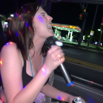 Your Karaoke Fun Cab - a woman singing into a microphone - Karaoke Near Me Your Karaoke Fun Cab - a woman singing into a microphone - Karaoke Near Me