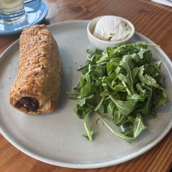 Proud Mary - Sausage Roll & Side Arugala Salad - Breakfast & Brunch Near Me - Austin, Texas Proud Mary - Sausage Roll & Side Arugala Salad - Breakfast & Brunch Near Me - Austin, Texas